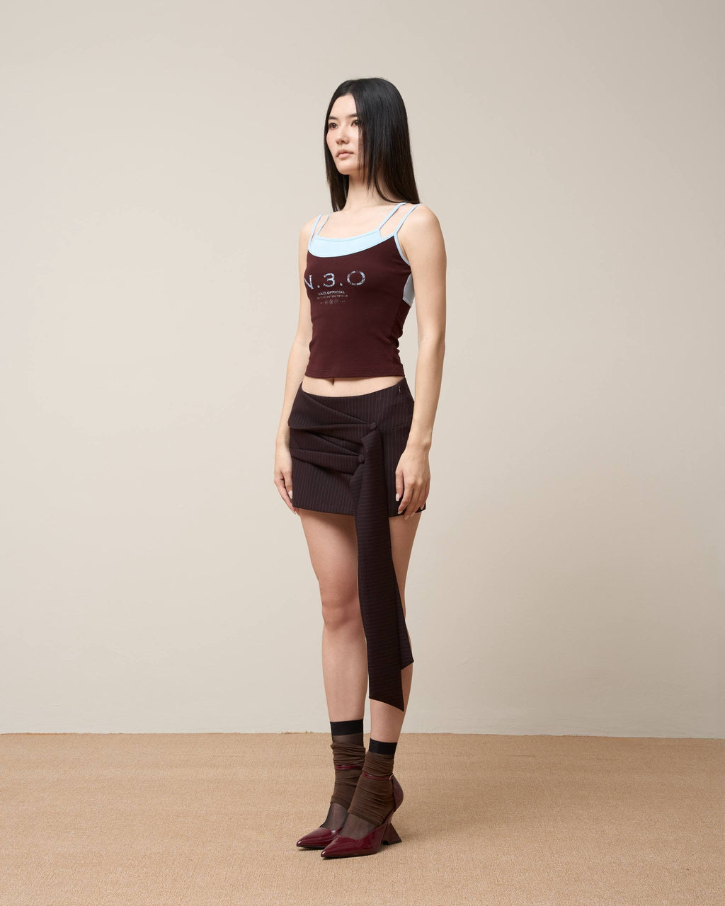 ASYMMETRICAL DRAPE TIE MINI SKIRT BLACK