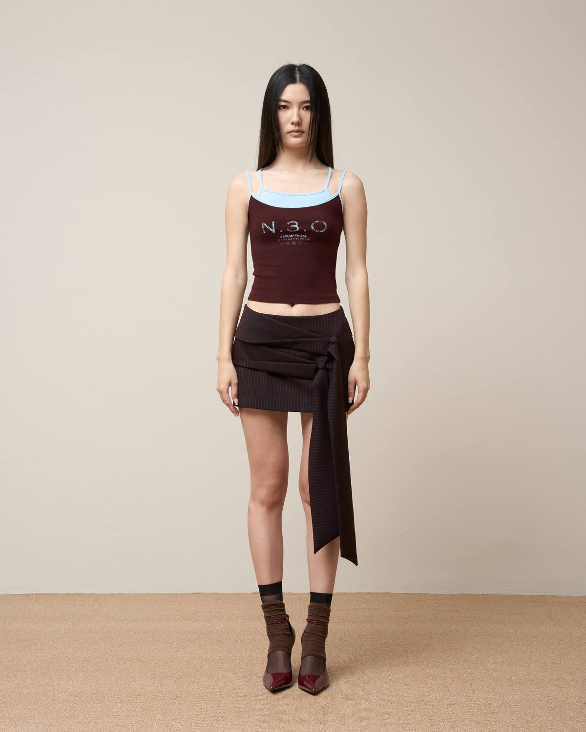 ASYMMETRICAL DRAPE TIE MINI SKIRT BLACK